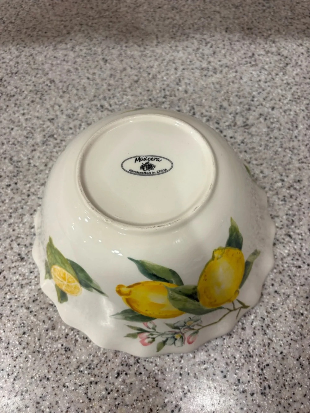 Hand-painted ceramic ruffle bowl featuring lemon motifs. Never Used. Display